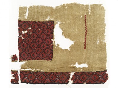 Fragment of Tunic with imitation of silk aplique © RGZM