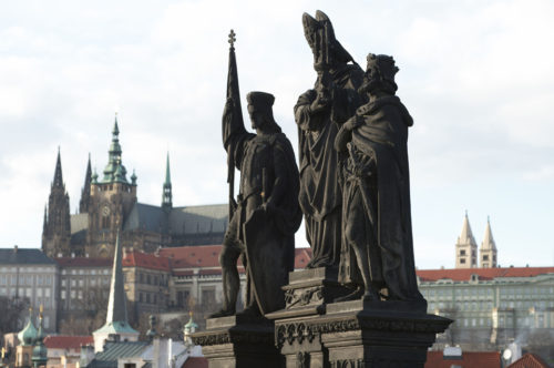 Sculpture of the ntional Saints of Bohemia: Norbert, Wenceslaus and Sigismund on the Charles Bridge. Source: Wikipedia