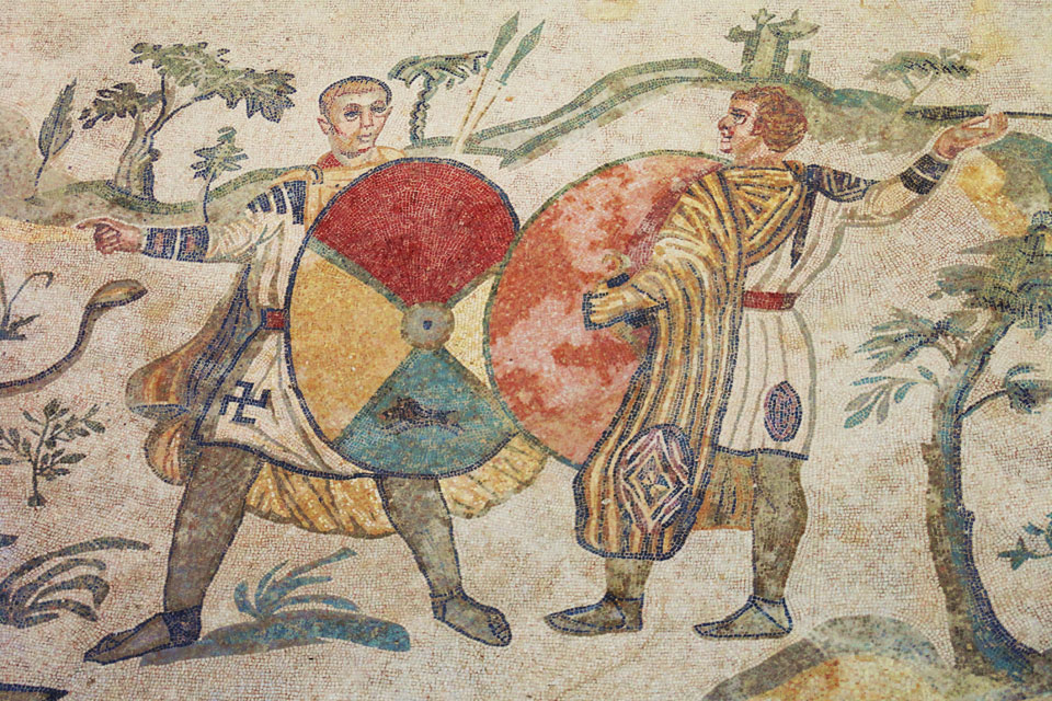 Tunics and trousers worn by two armed fighters in the Villa Armerina in Sicily, 4th century. Source: wikipedia